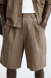 CREASED-EFFECT PLEATED BERMUDA SHORTS