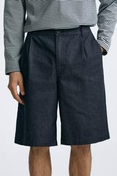 PLEATED DENIM BERMUDA SHORTS