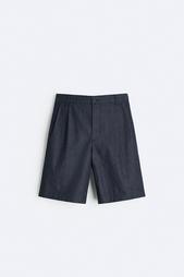 PLEATED DENIM BERMUDA SHORTS